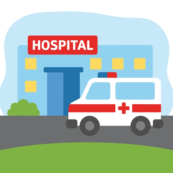 White ambulance with red stripes and red cross parked outside a blue hospital building with a red HOSPITAL sign and yellow windows.