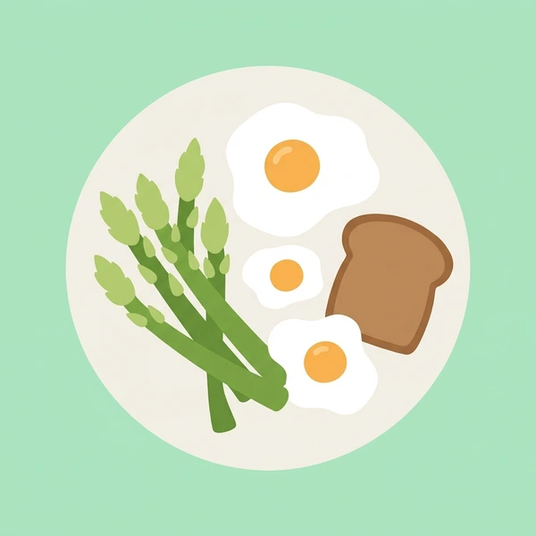 Fresh green asparagus spears arranged neatly on a white brunch plate