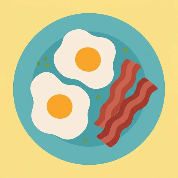 Crispy bacon strips served beside eggs on a breakfast plate