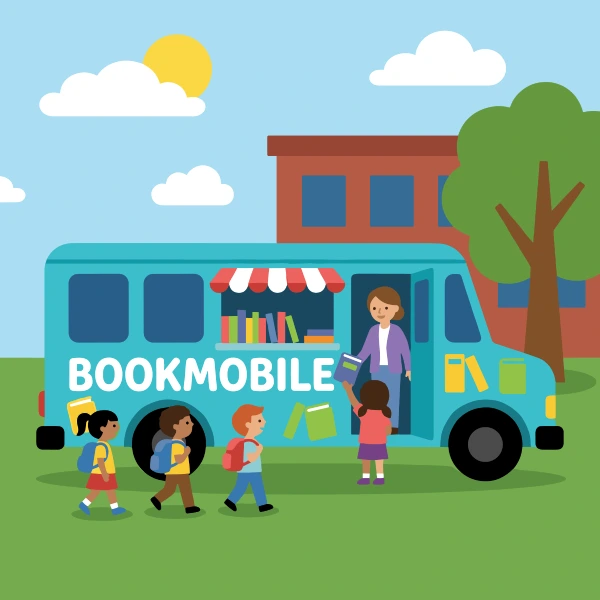 Bookmobile van parked beside a school building with children on the grass and a big BOOKMOBILE sign on the side.