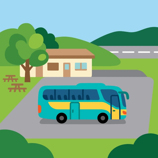 Coach bus in teal, navy blue, and leaf green at rest stop, with light blue sky and gray ground.