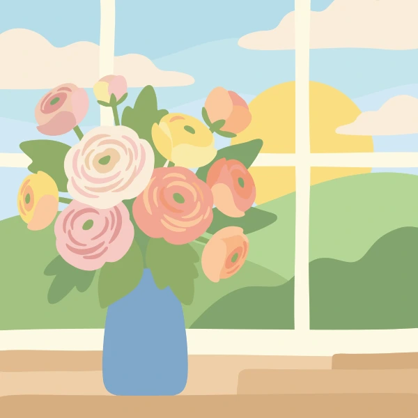 Layered pink, peach, cream, and yellow ranunculus flowers in a blue glass vase on a warm wooden windowsill with a sunrise meadow visible outside