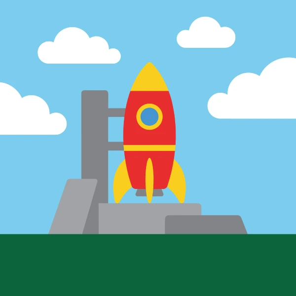 Red and yellow cartoon rocket on a grey concrete launch pad with a support tower, blue sky, white clouds, and dark green ground.