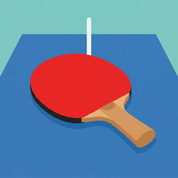 Red table tennis paddle with black edge on a blue table tennis table beside a white dividing net